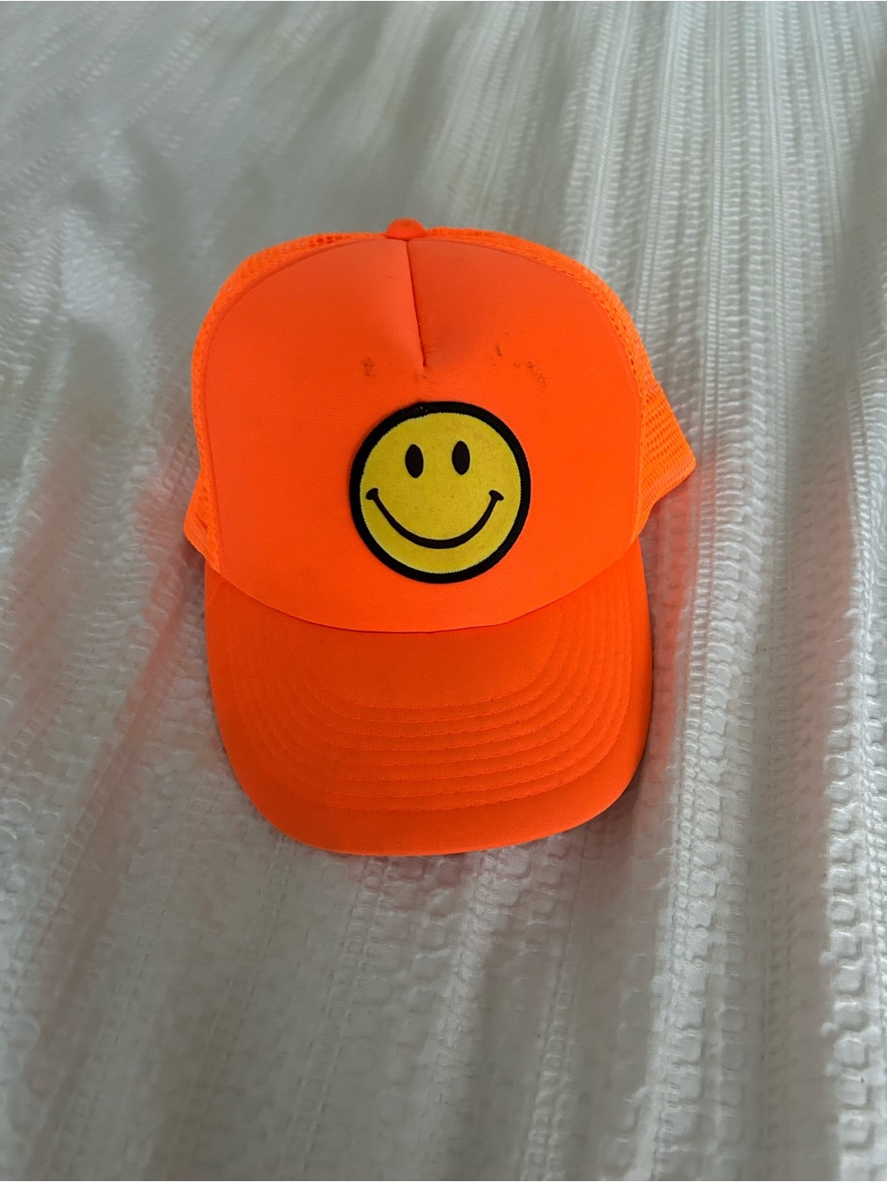 Neon Orange Smiley Face Trucker Hat